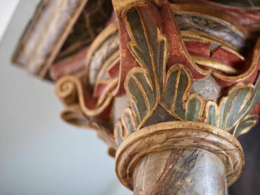 A close-up of ornate, intricately carved columns with a classical design.