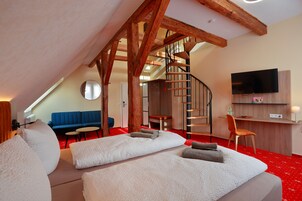 Comfort Quadruple Room | Living area | 32-inch flat-screen TV with satellite channels, TV