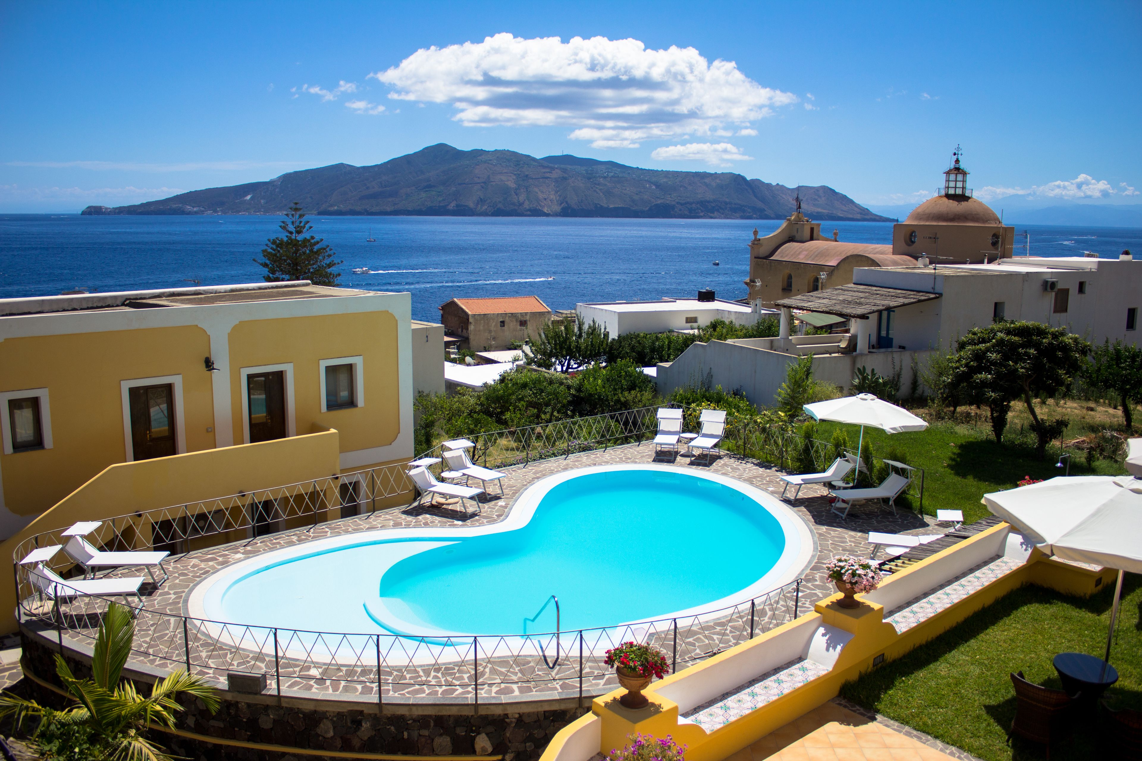 Seasonal outdoor pool, an infinity pool, pool umbrellas, sun loungers