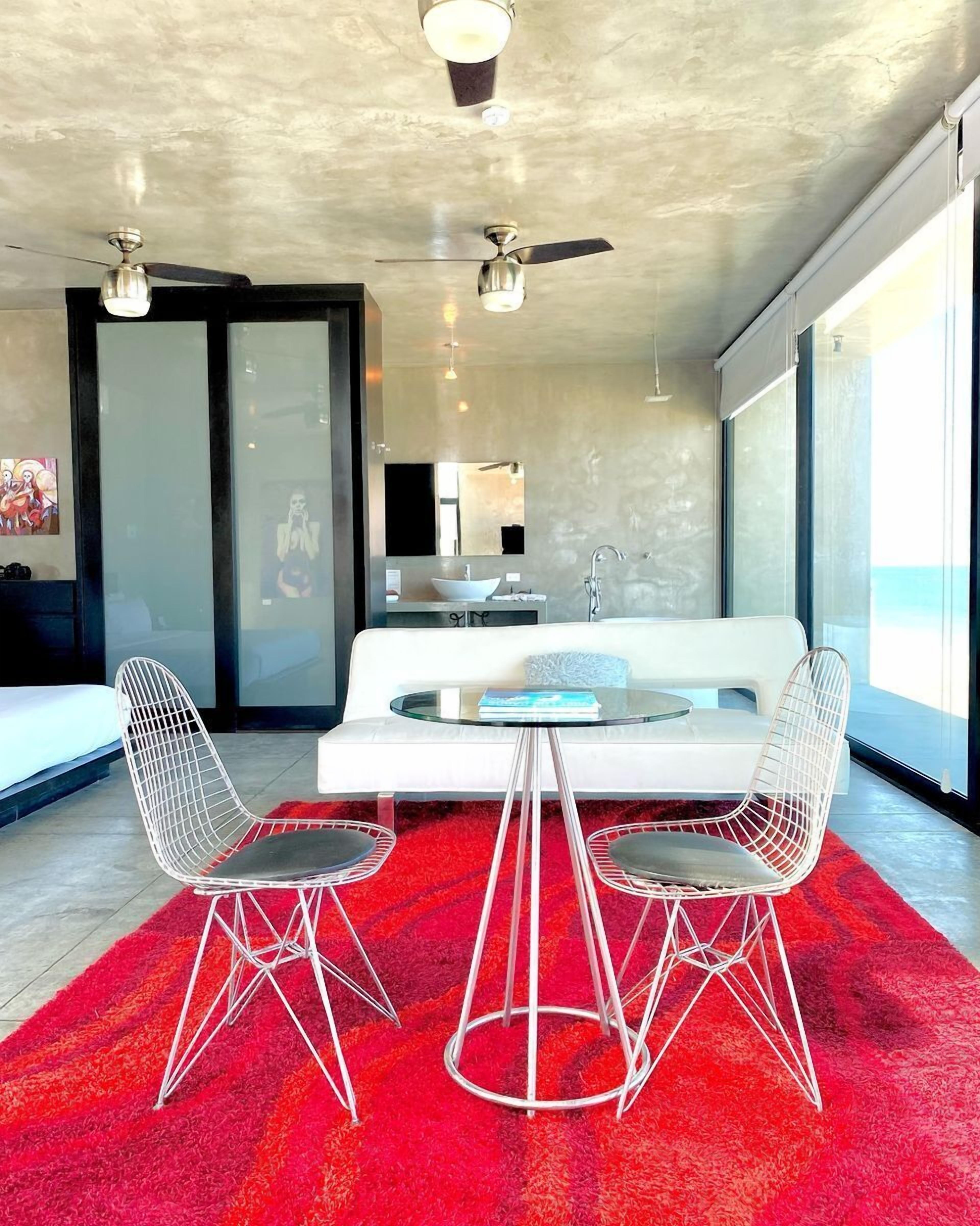 Honeymoon Studio Suite, Sea View | Living area | 40-inch flat-screen TV with satellite channels, TV, iPod dock