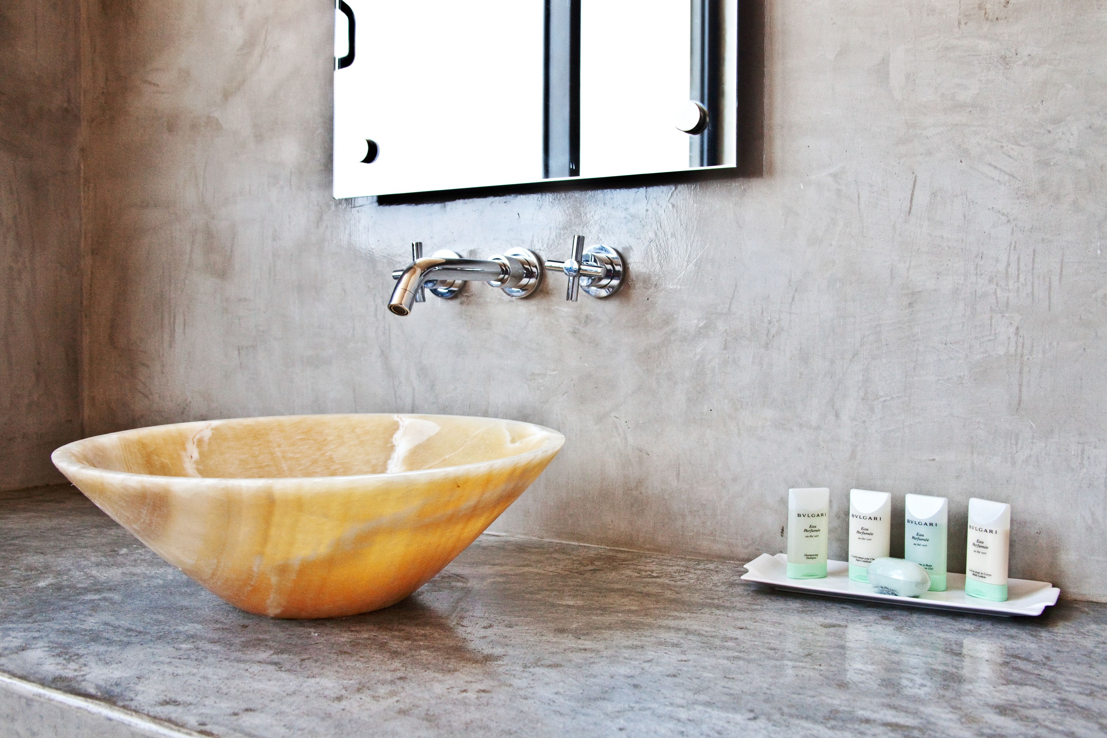 designer toiletries, hair dryer, towels, soap