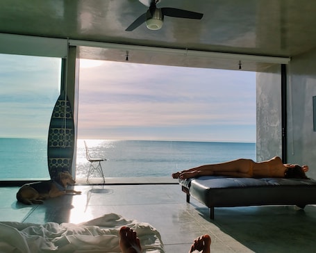 Honeymoon Studio Suite, Sea View | Living area | 40-inch flat-screen TV with satellite channels, TV, iPod dock