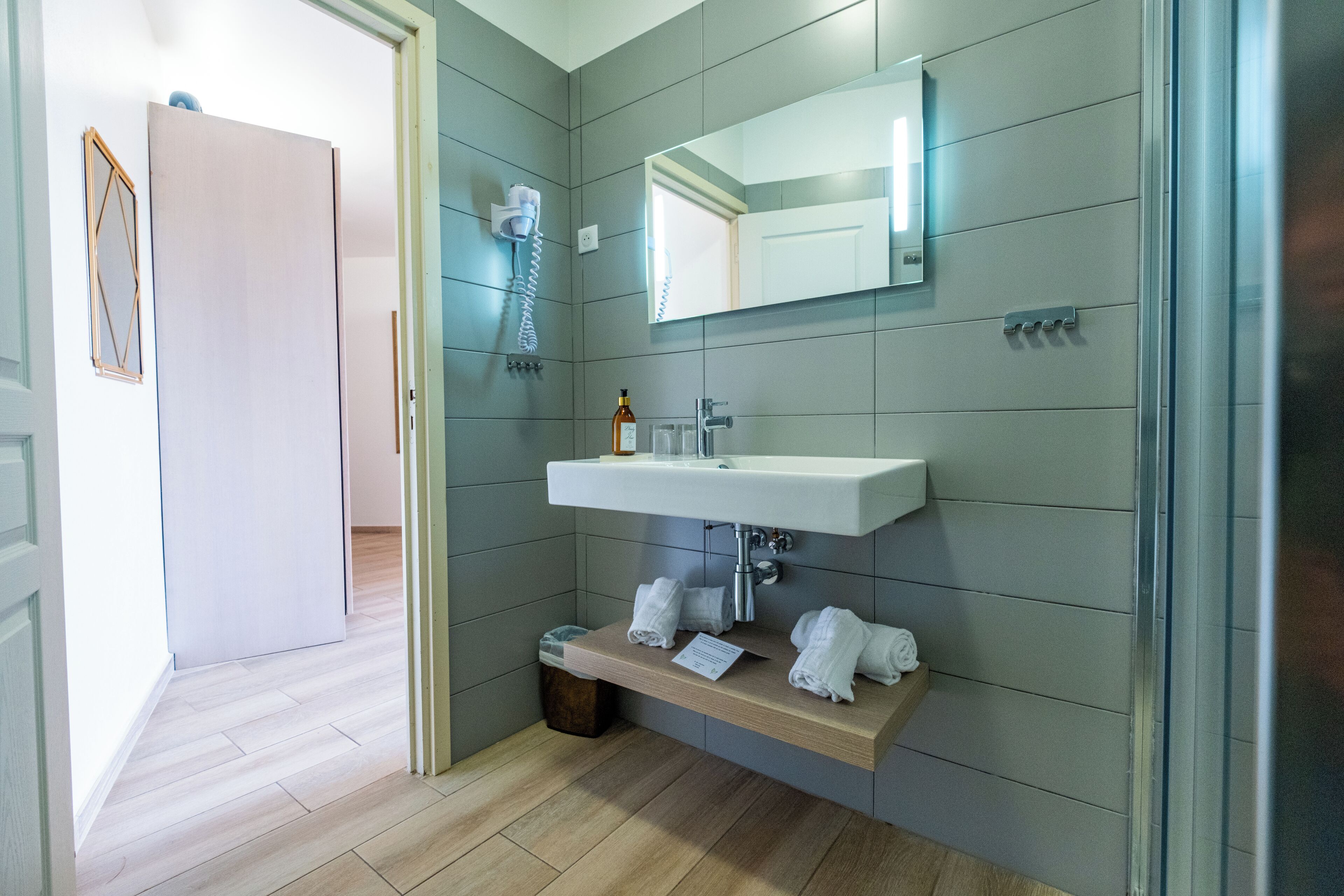 superior room | bathroom | shower, rainfall showerhead, hair dryer, towels