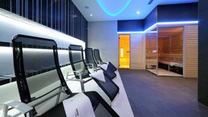 A modern spa area with massage chairs and a sauna. - Hotel Davídek (Trutnov)