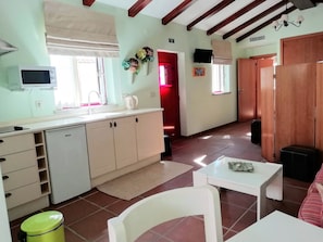Studio | Private kitchenette | Microwave, electric kettle, highchair, dining tables