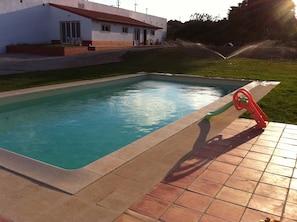 Seasonal outdoor pool, pool umbrellas, pool loungers