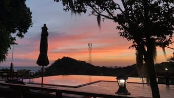 Outdoor pool, open 7:00 AM to 10:00 PM, pool umbrellas, sun loungers