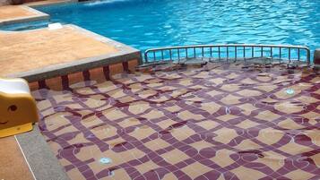 Outdoor pool, open 6:30 AM to 8:00 PM, pool loungers