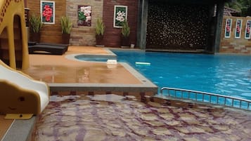 Outdoor pool, open 6:30 AM to 8:00 PM, pool loungers