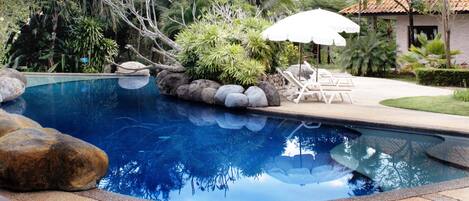 Outdoor pool, pool umbrellas, sun loungers