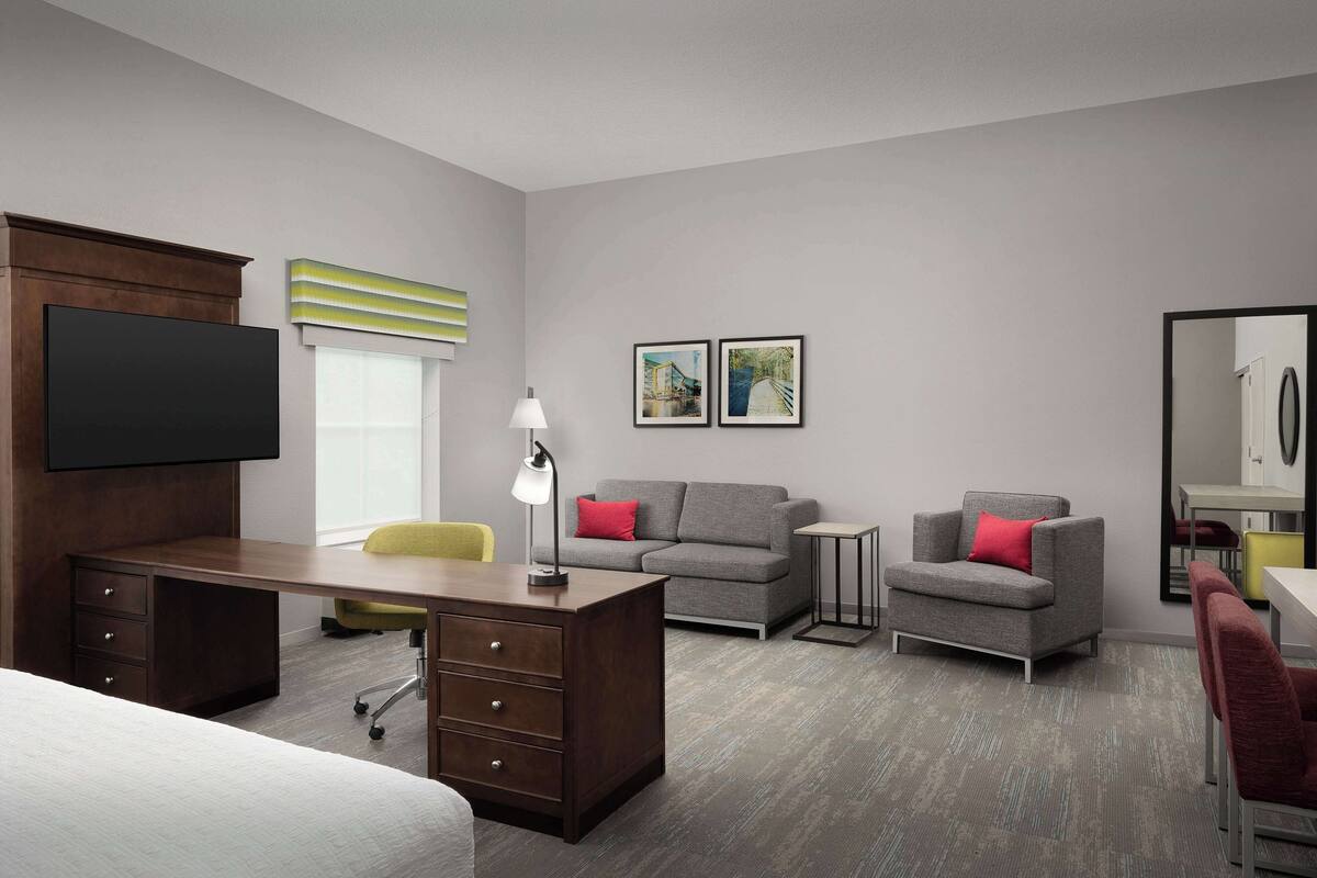 Desk, laptop workspace, blackout drapes, iron/ironing board