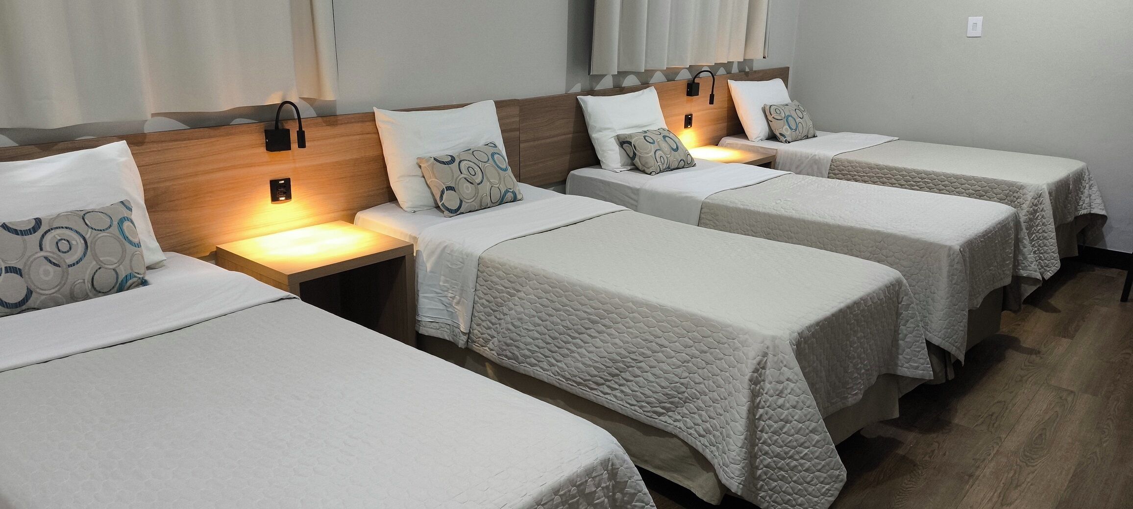 Deluxe Quadruple Room | Minibar, in-room safe, desk, laptop workspace