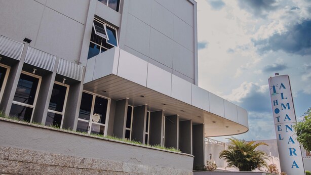 A modern building with a prominent sign reading "TALHOTARA". - Hotel Almanara (Cuiabá)