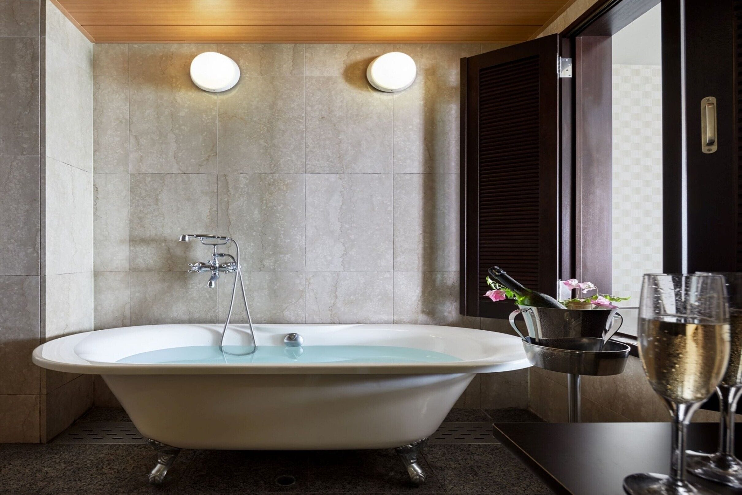 cypress suite, non smoking, ocean view | bathroom | combined shower/bathtub, deep-soaking bathtub, designer toiletries