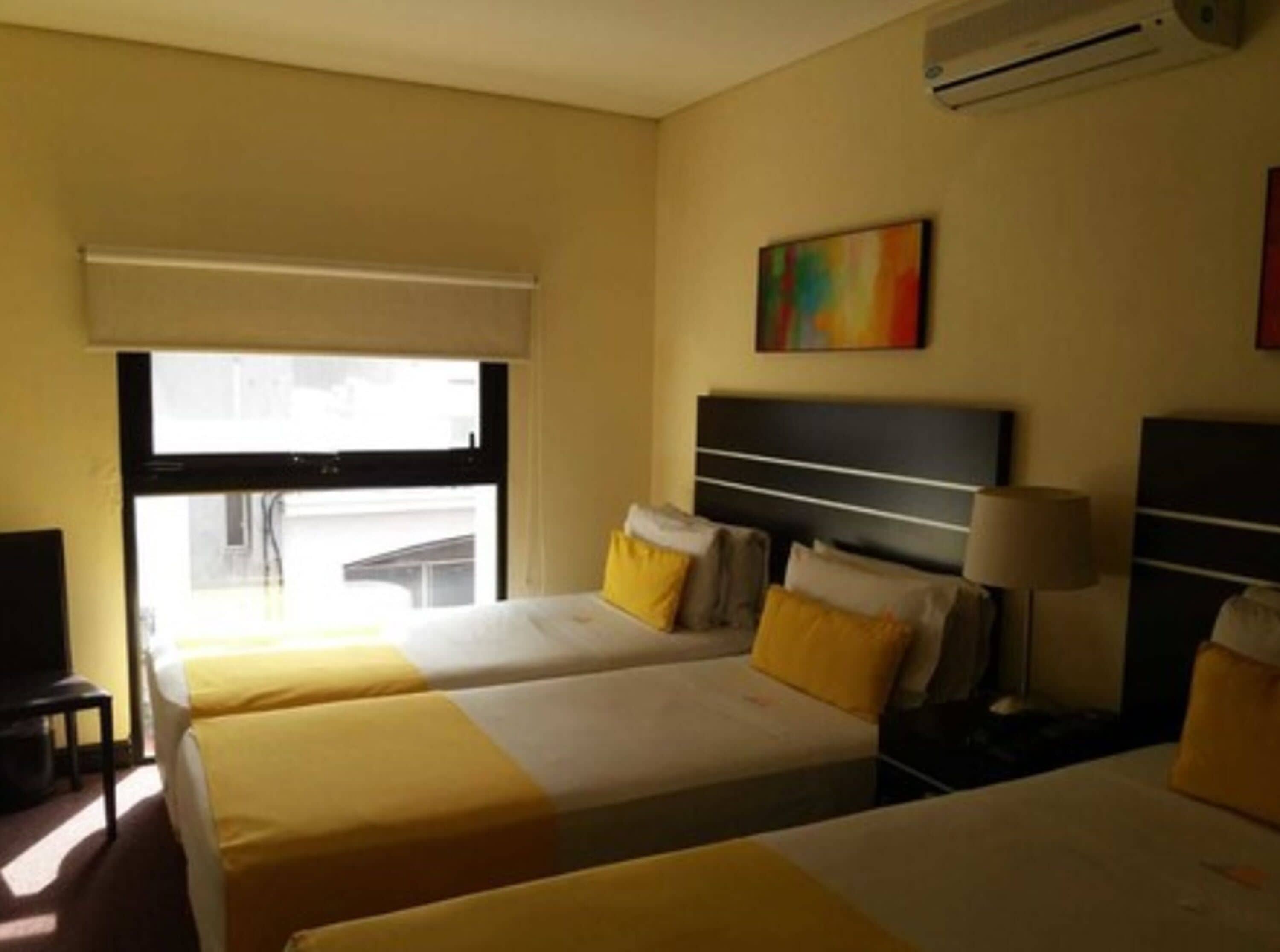 standard triple room, 3 single beds | 1 bedroom, minibar, in-room safe, individually decorated