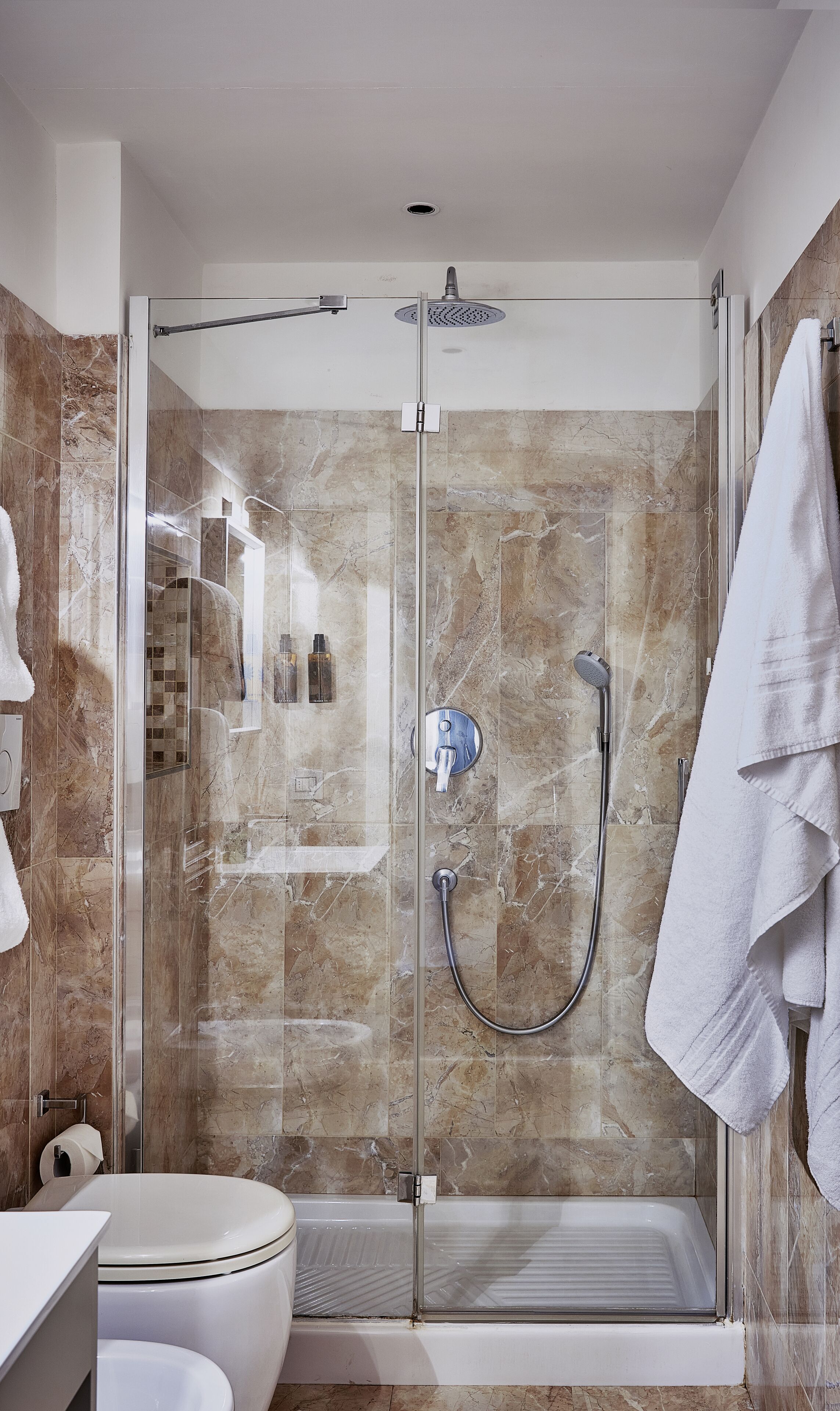 rainfall showerhead, hair dryer, slippers, bidet