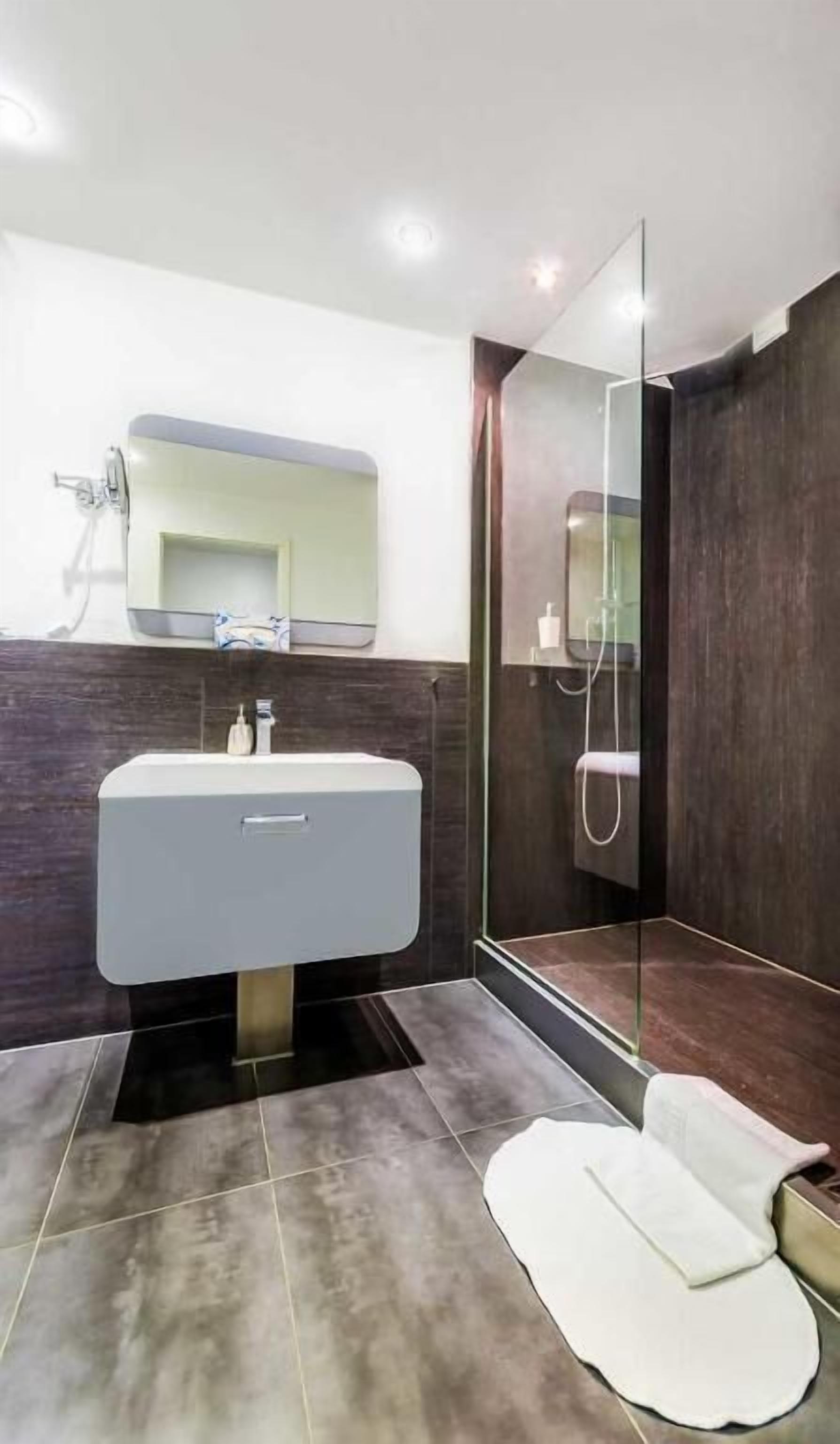 shower, rainfall showerhead, hair dryer, towels