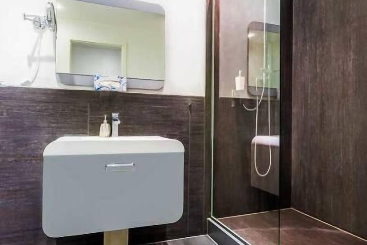 shower, rainfall showerhead, hair dryer, towels