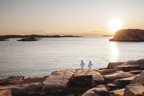 A coastal landscape with rocky terrain and a body of water.