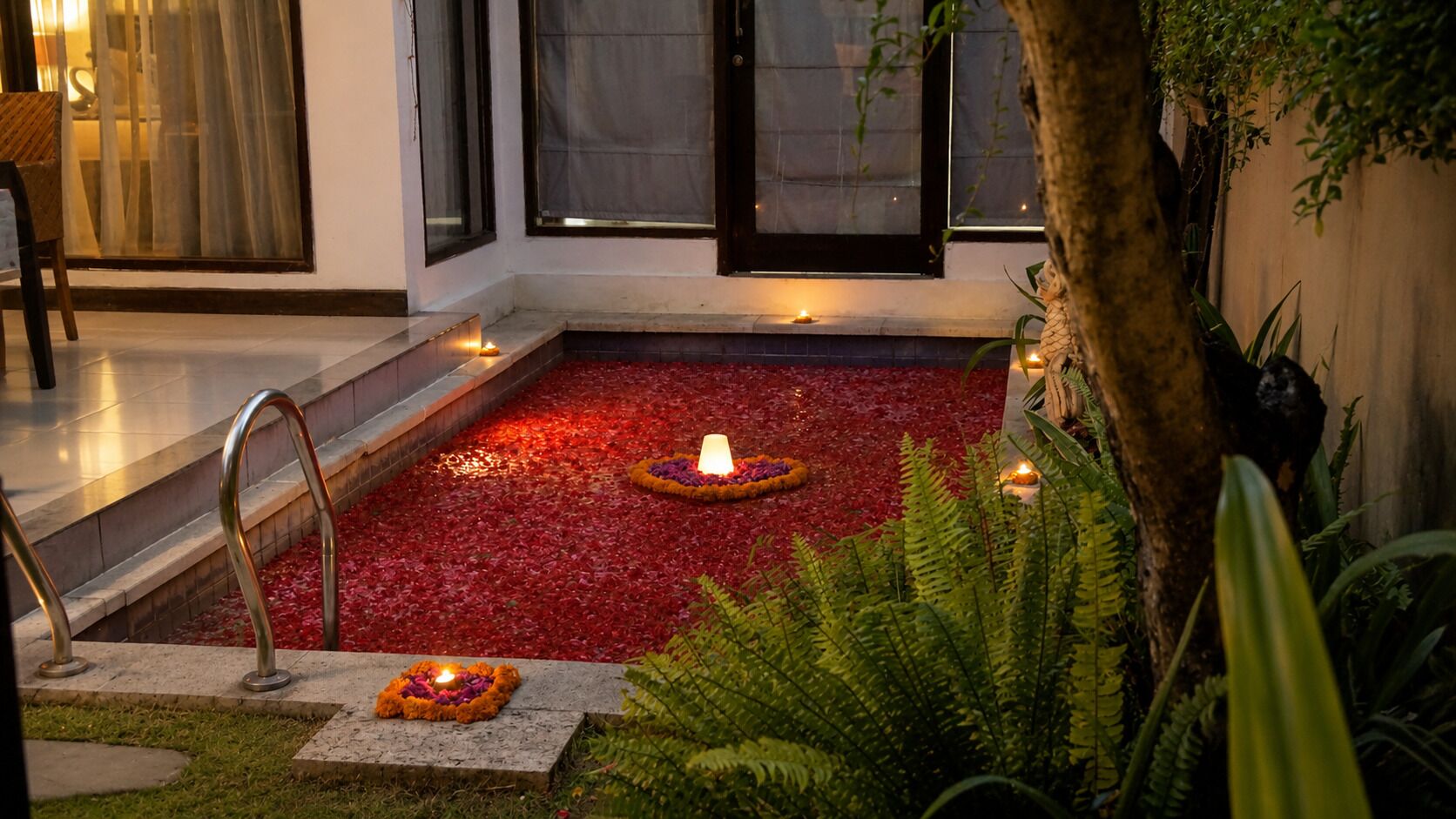 A serene indoor garden with a water feature, stone steps, and a seating area.