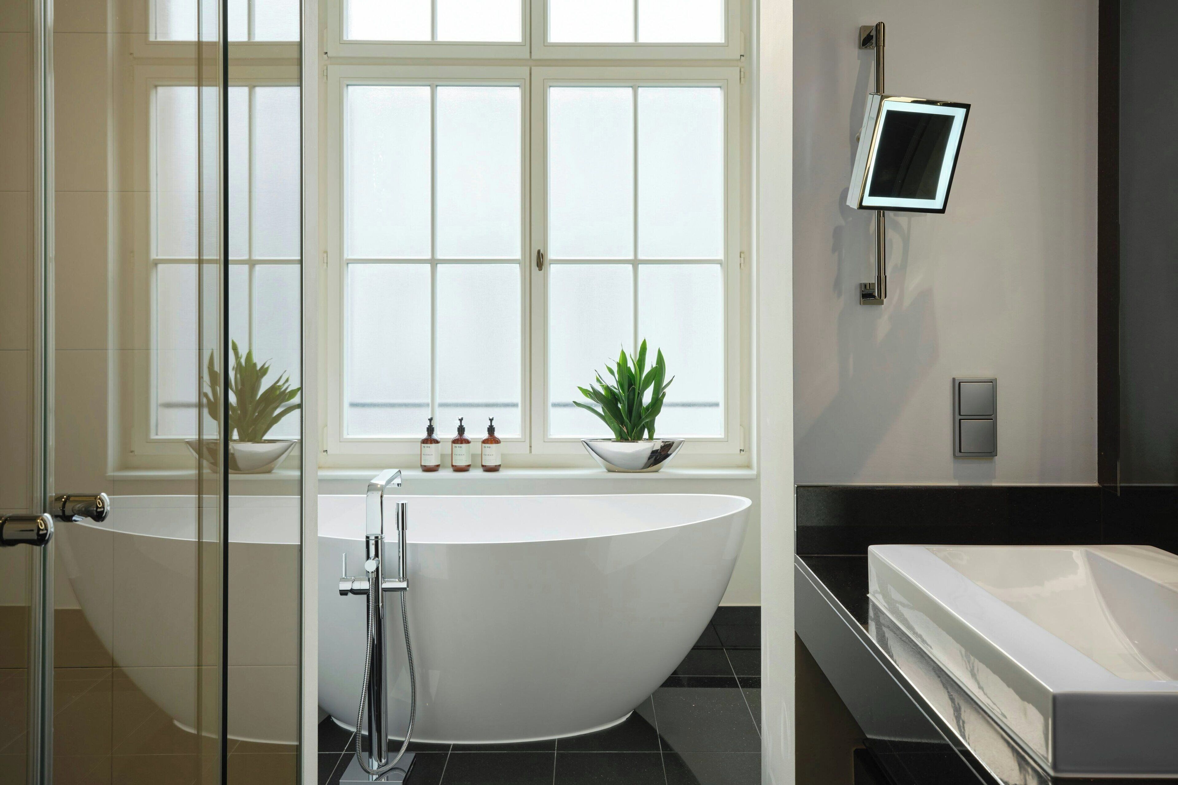 designer toiletries, hair dryer, slippers, towels