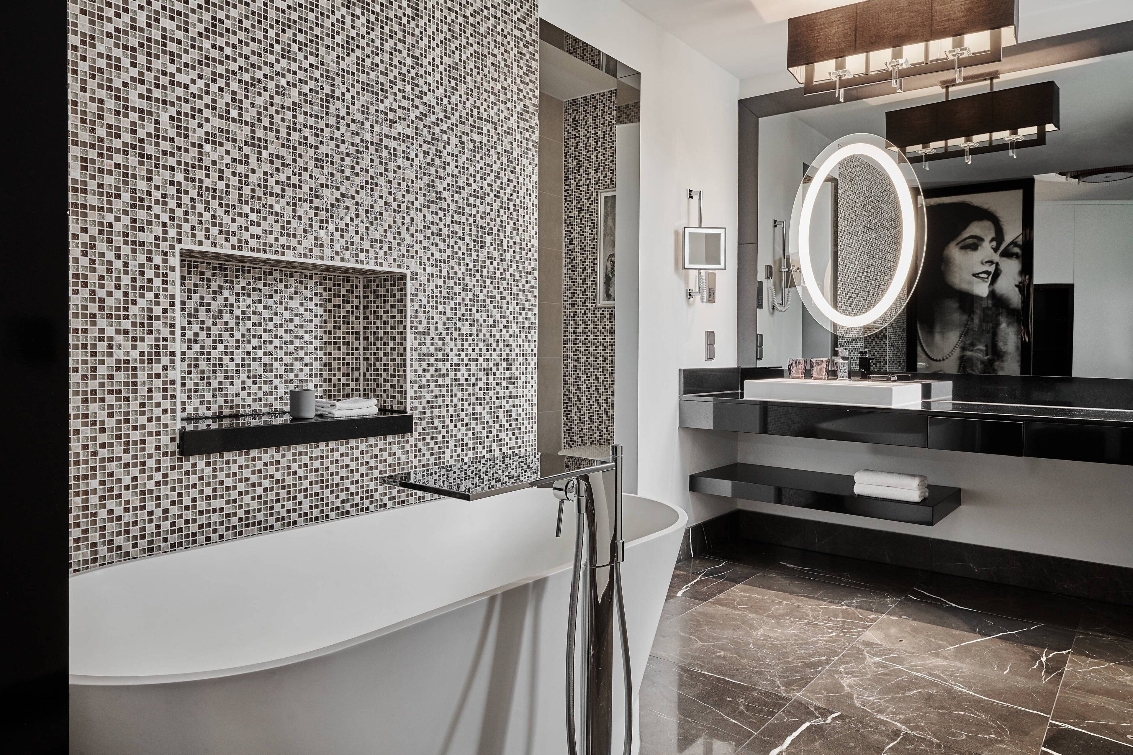 designer toiletries, hair dryer, slippers, towels