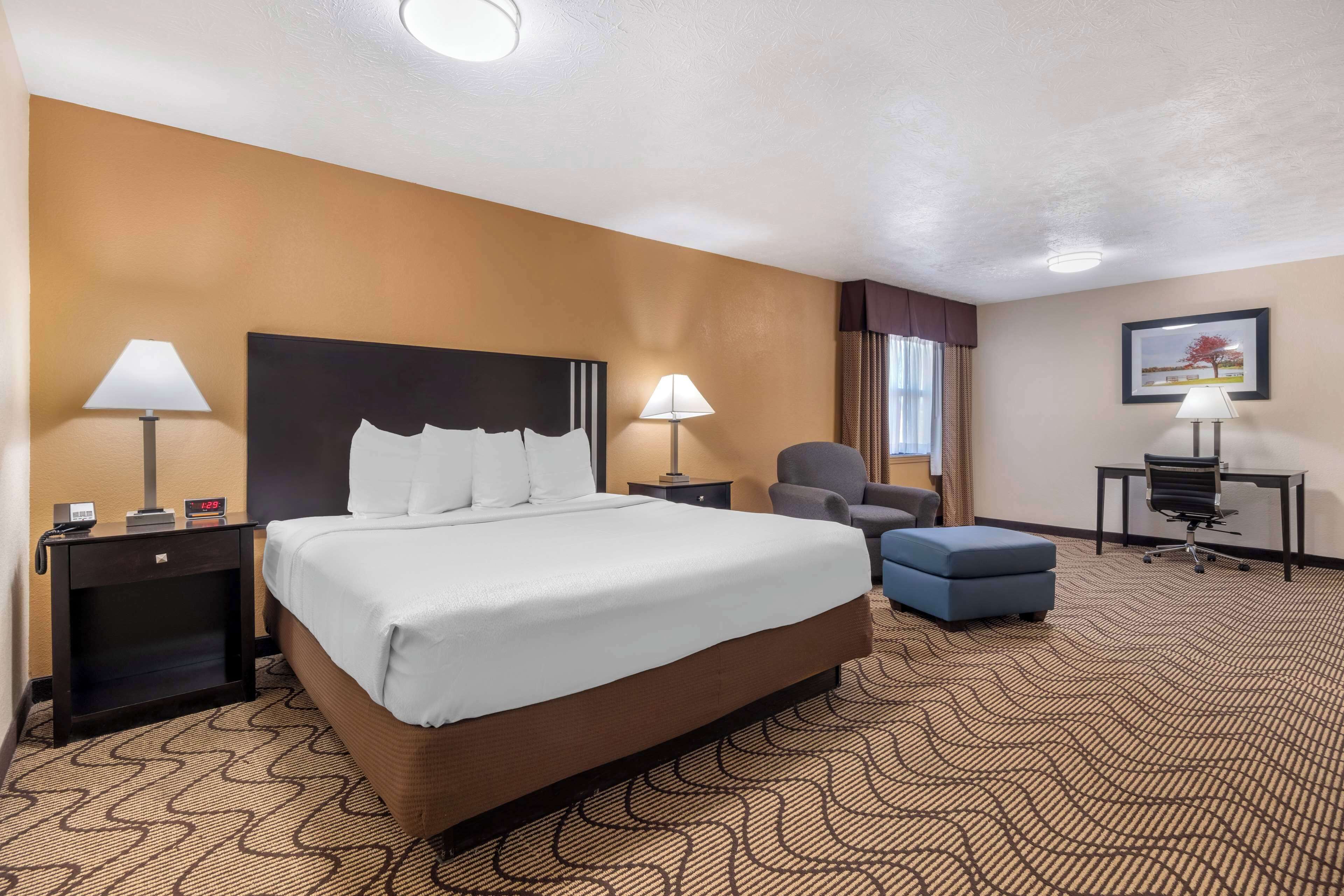 suite, 1 king bed, non smoking, microwave | premium bedding, iron/ironing board, rollaway beds, free wifi