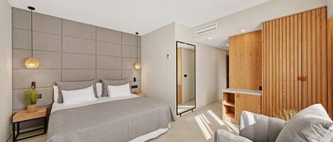 A modern bedroom with a large bed, bedside tables, a mirror, and a wooden wardrobe.