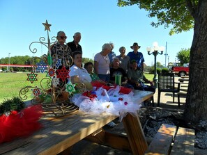 A wooden table with decorative items and a star-shaped metal sculpture.