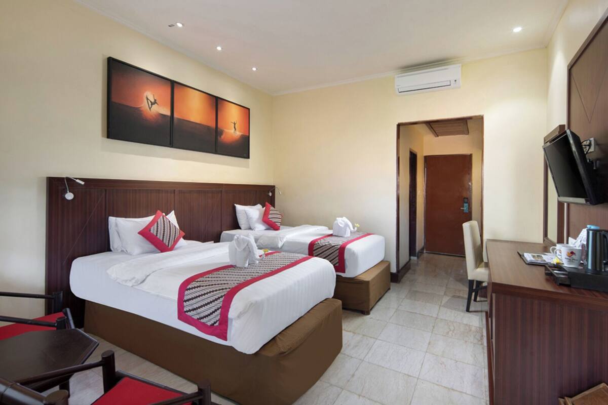 Superior Triple Room | Minibar, in-room safe, desk, blackout drapes