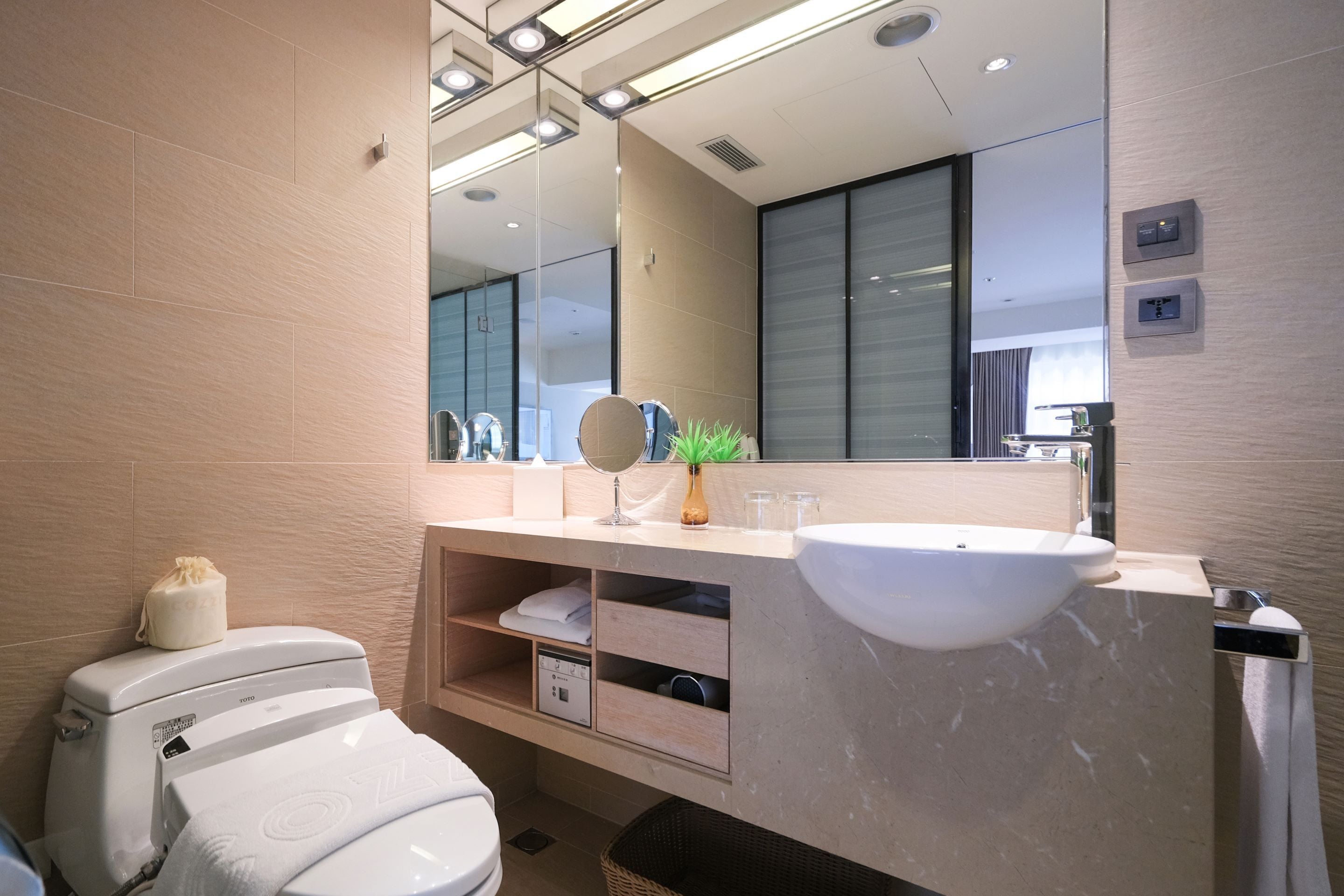 eco-friendly toiletries, hair dryer, slippers, towels