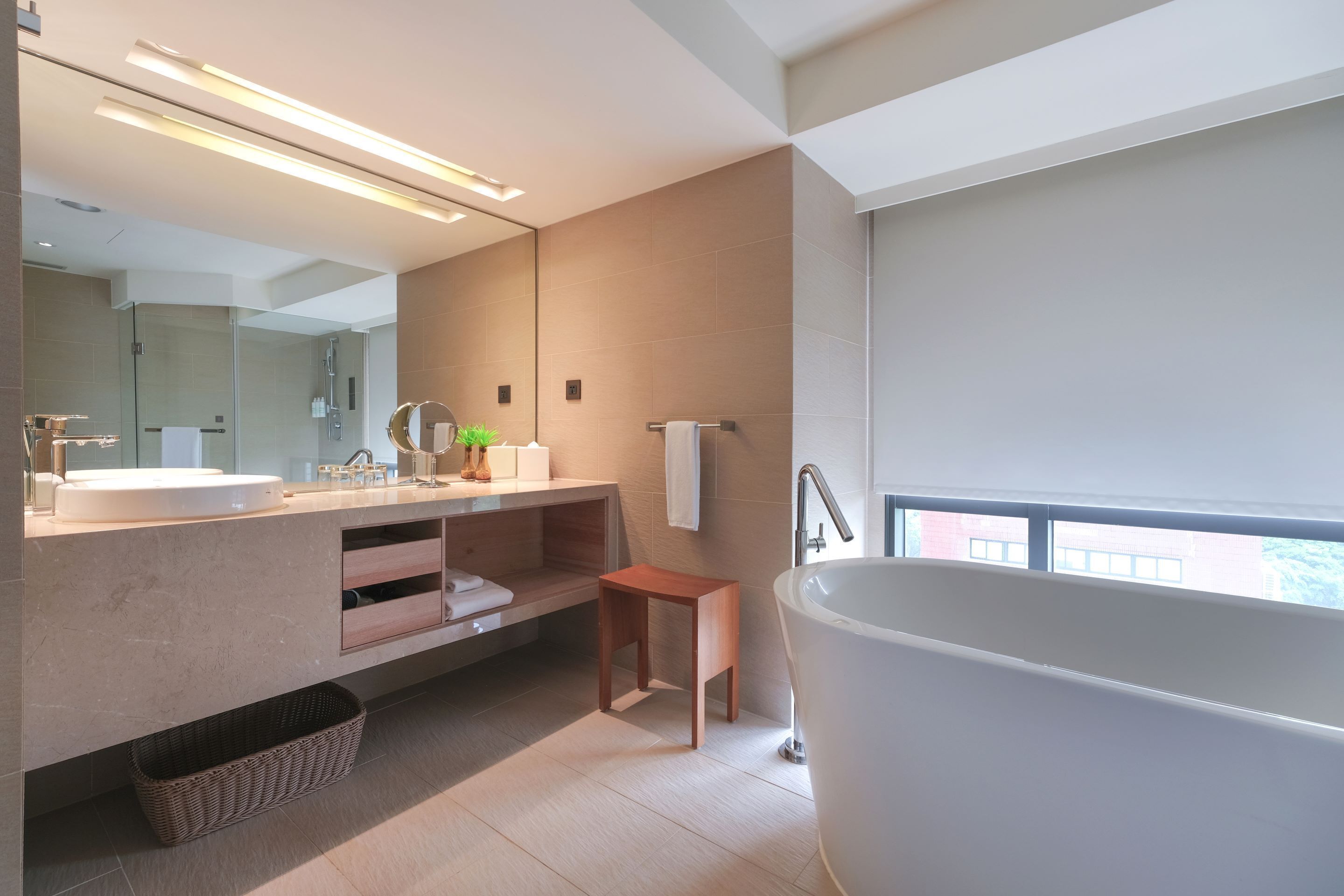 cozzi corner twin room  | bathroom | eco-friendly toiletries, hair dryer, slippers, towels