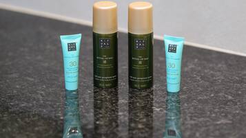 Three skincare products on a countertop.
