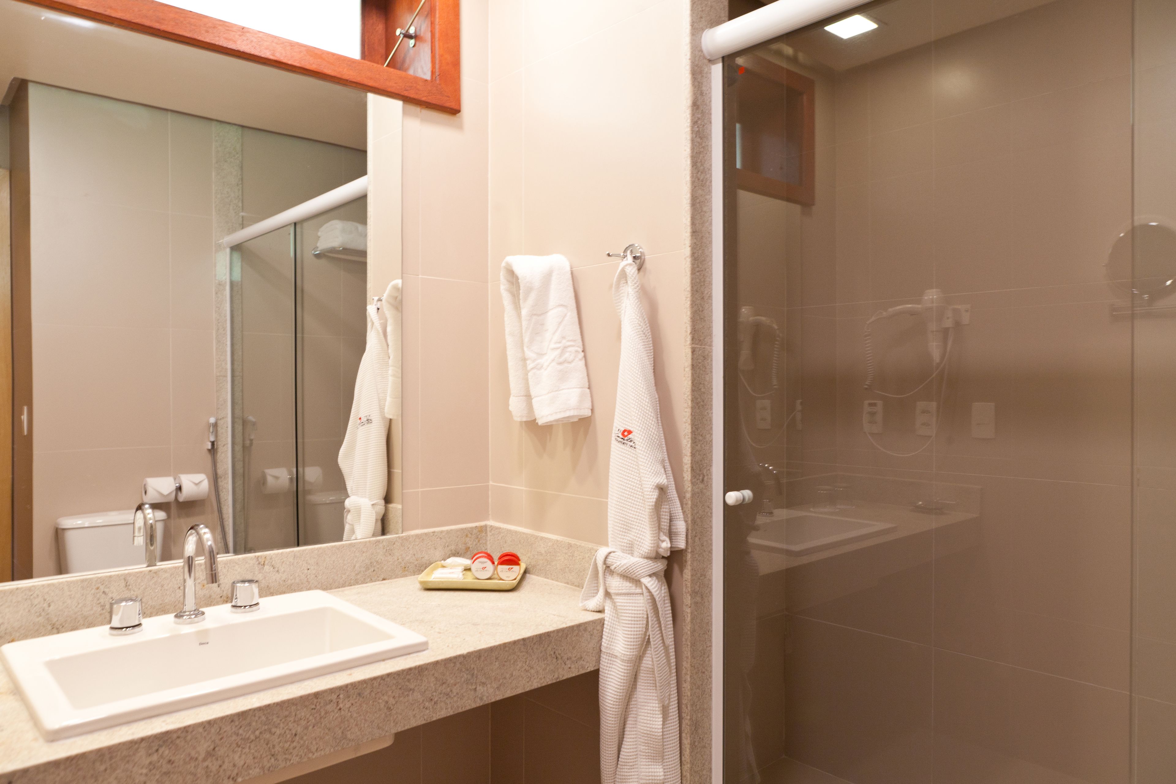 deluxe superior room | bathroom | shower, free toiletries, hair dryer, towels