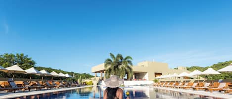 Outdoor pool, pool umbrellas, sun loungers