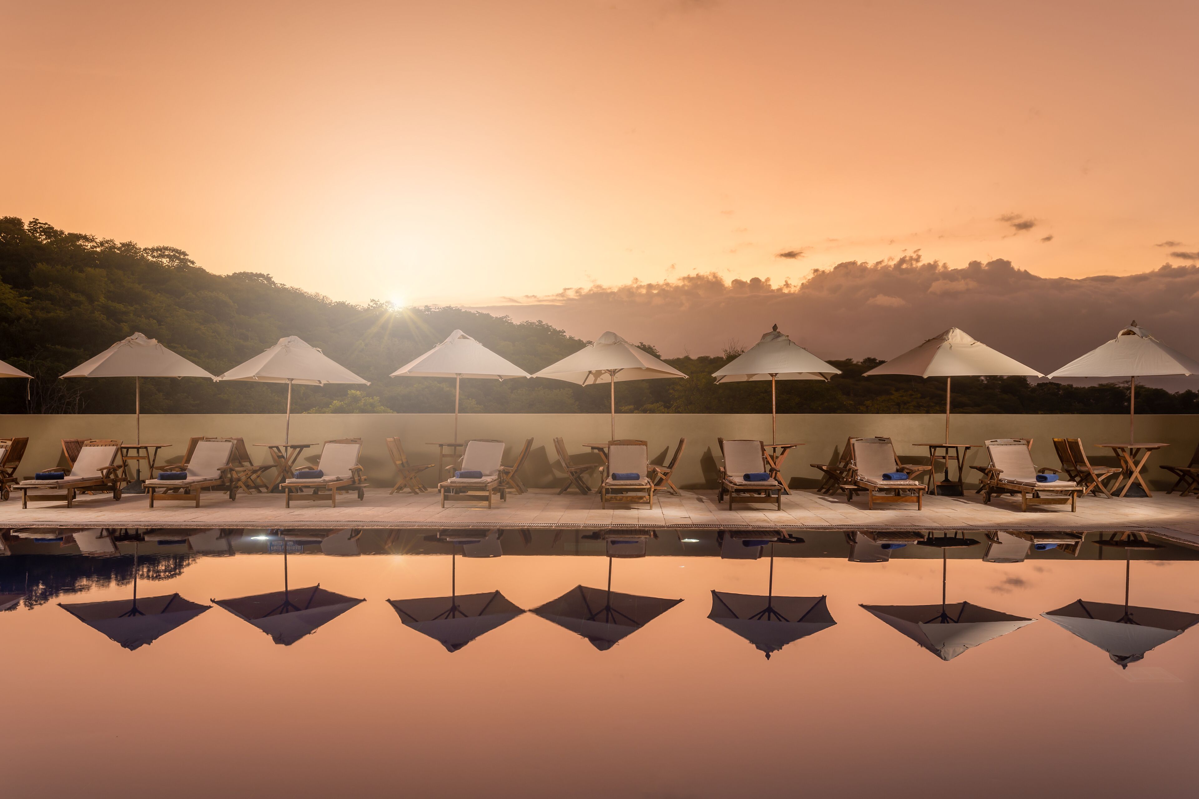 outdoor pool, pool umbrellas, pool loungers