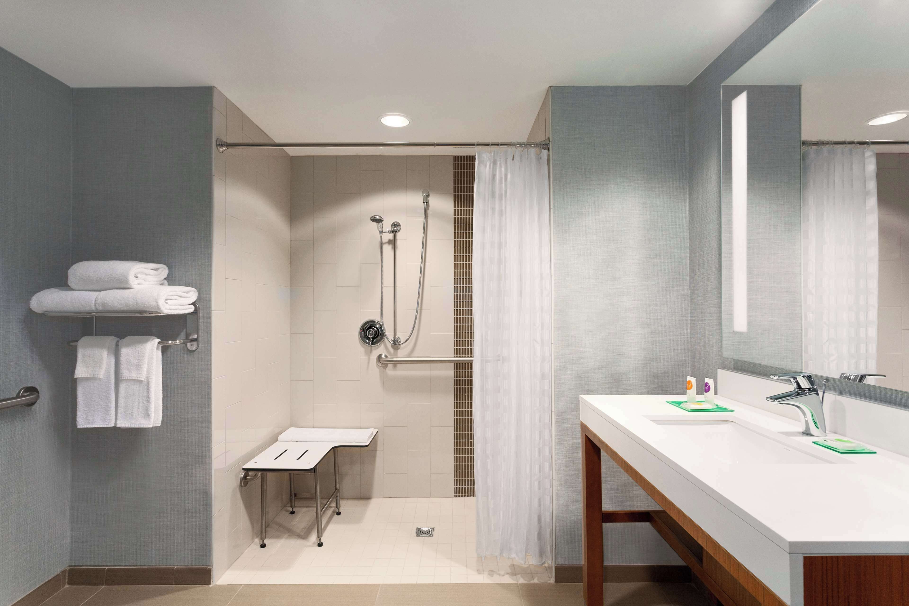 room, 1 king bed, accessible (shower) | bathroom | combined shower/bathtub, designer toiletries, hair dryer, towels