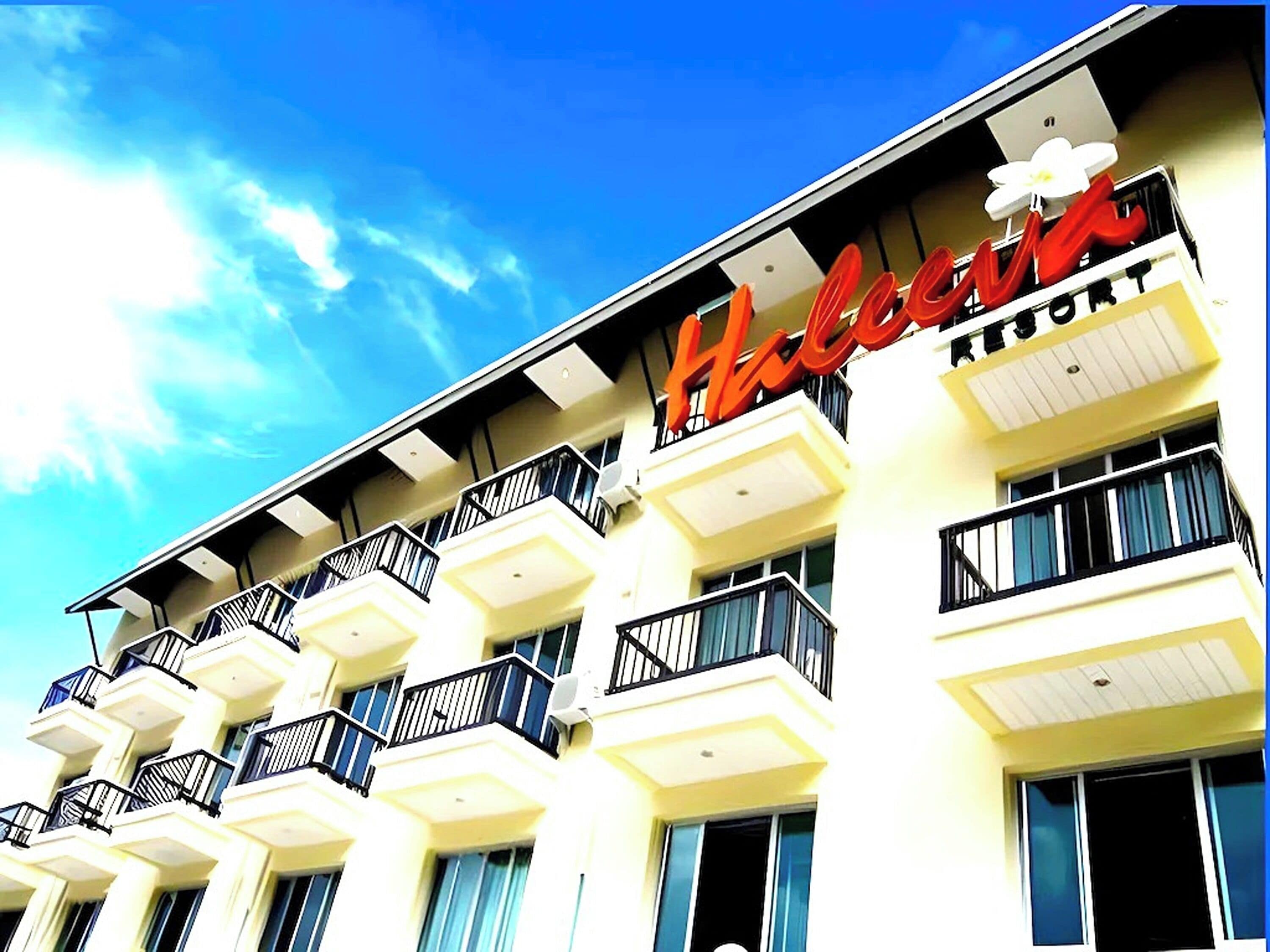 A hotel with a prominent red sign reading "Hotel".