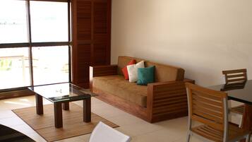 Suite, 1 Bedroom, Sea View | Living area | Flat-screen TV