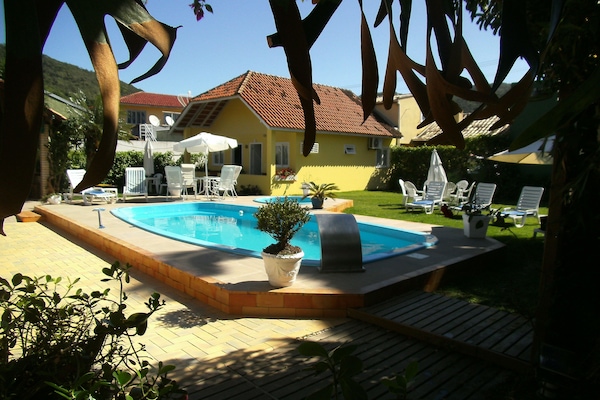 2 outdoor pools, open 9:00 AM to 9:30 PM, pool umbrellas, pool loungers