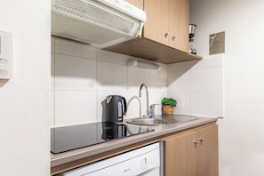 Grand Apartment | Private kitchen | Fridge, microwave, stovetop, dishwasher