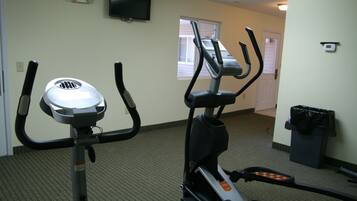 Stay fit on the go with our fully equipped fitness room featuring stationary bikes and a TV for entertainment.