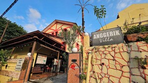 A building with a sign reading "Anggerik Villa." - Anggerik Lodging Hotel (George Town)