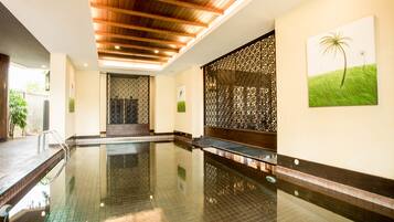 Indoor pool, open 7:00 AM to 6:00 PM, pool umbrellas, pool loungers