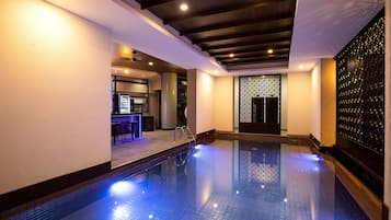 Indoor pool, open 7:00 AM to 6:00 PM, pool umbrellas, pool loungers