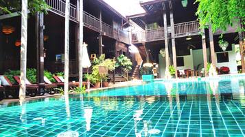 Outdoor pool, open 8:00 AM to 8:00 PM, pool loungers