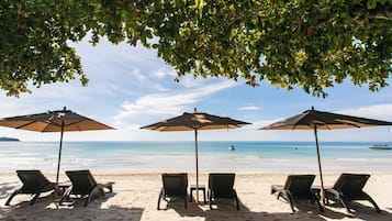 On the beach, white sand, beach towels, kayaking