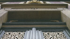 A detailed architectural entrance with ornate metalwork and a central door. - Hotel zur Krone (Gescher)