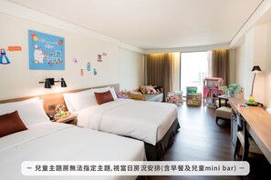 A hotel room with two beds, a desk, a mini bar, and children's toys. - Just Sleep Hualien Zhongzheng (Hualien City)