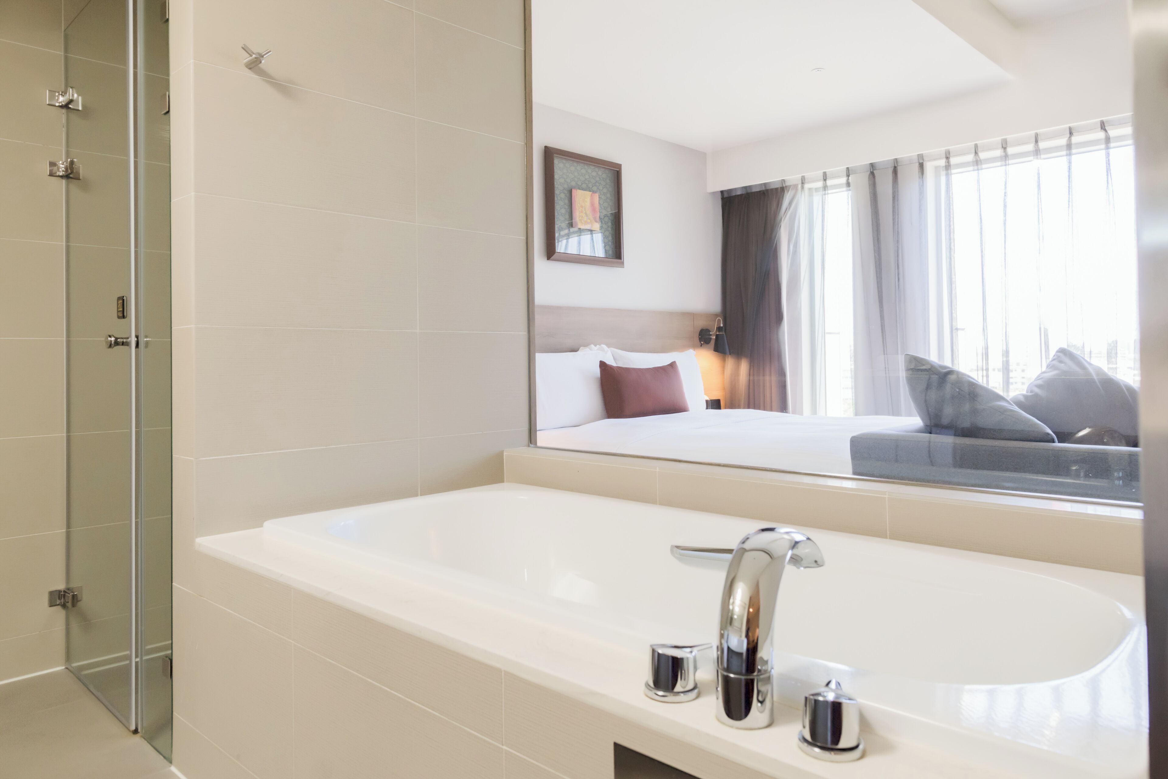 deluxe double room | bathroom | shower, hair dryer, slippers, towels